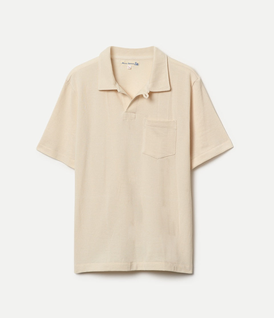 Beige loopwheeled pikee polo shirt on a light gray background