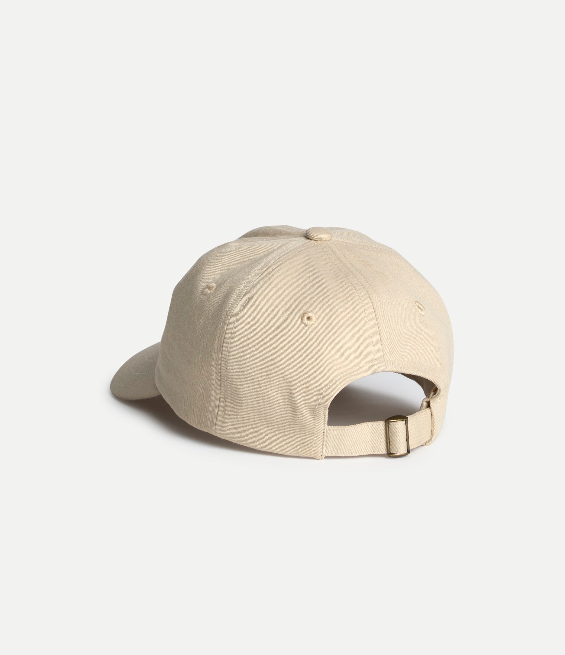 Beige baseball cap on a light gray background