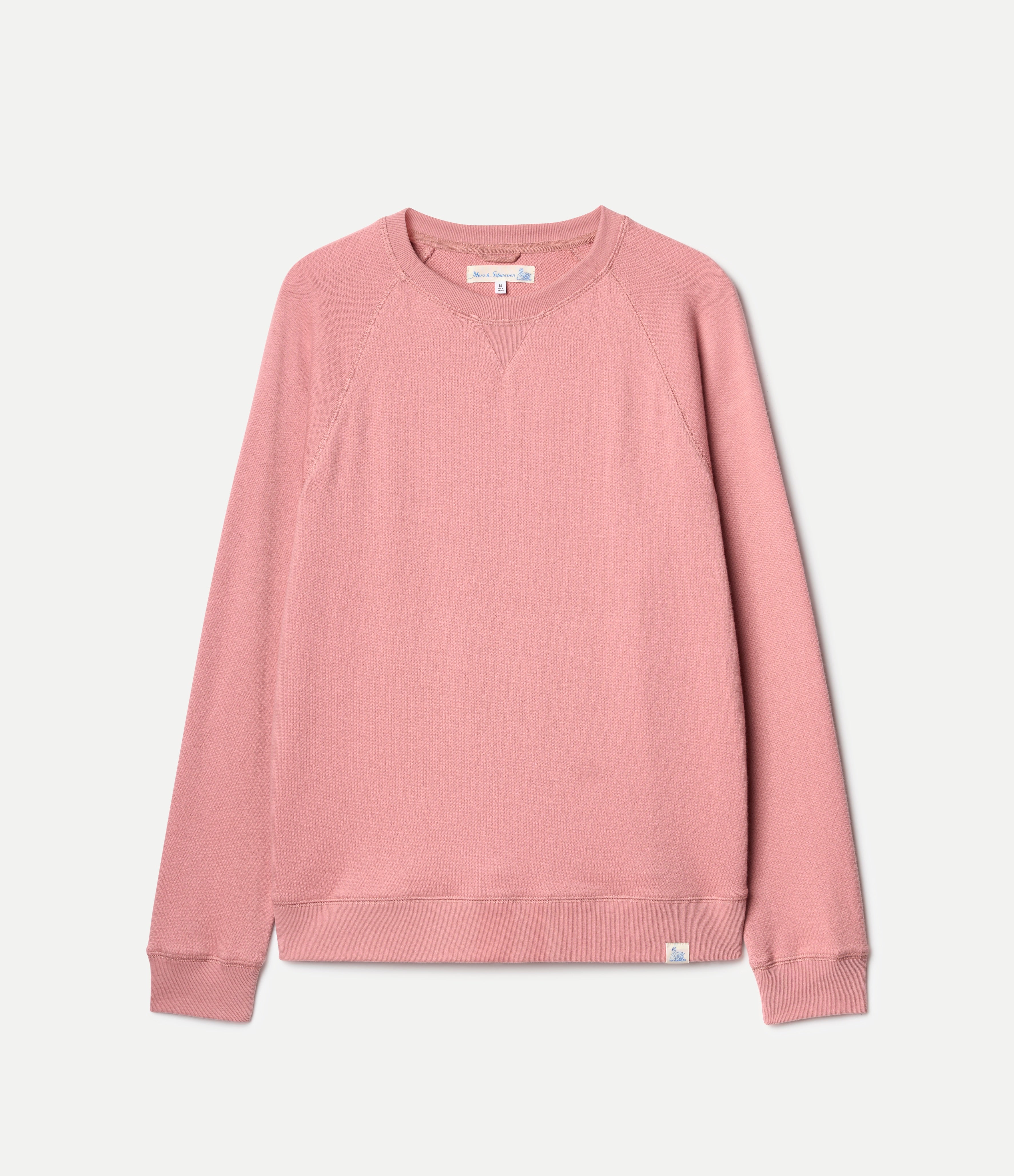 Pink sweatshirt on a light gray background