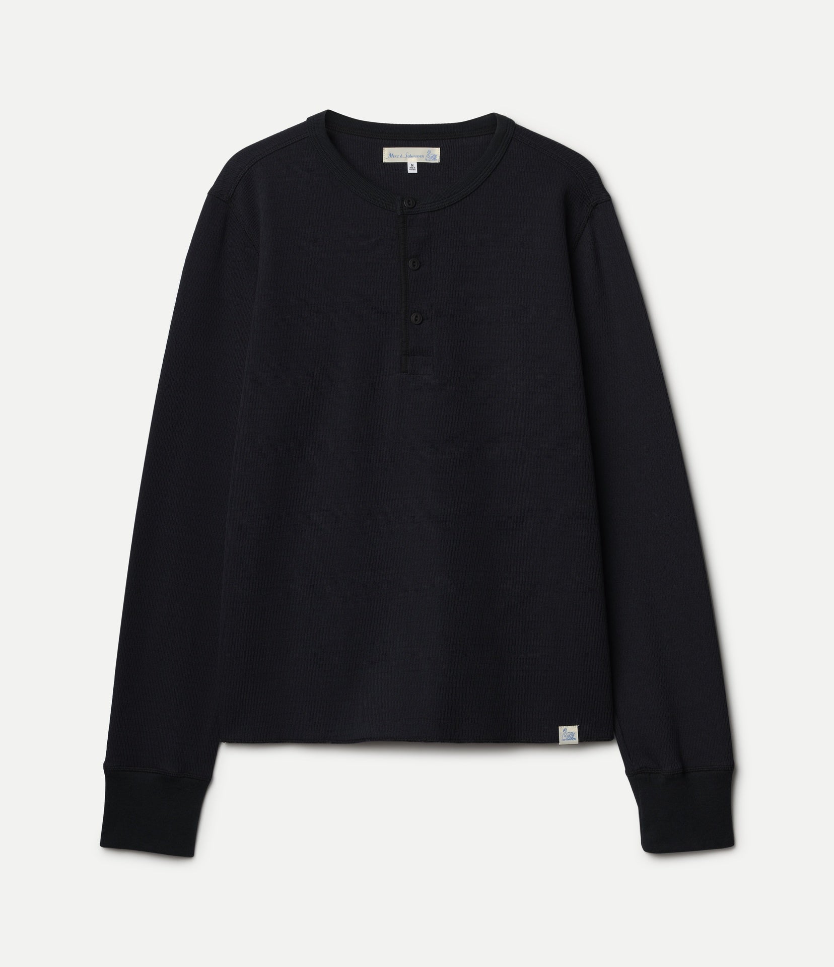 Black long-sleeve henley shirt on a light gray background