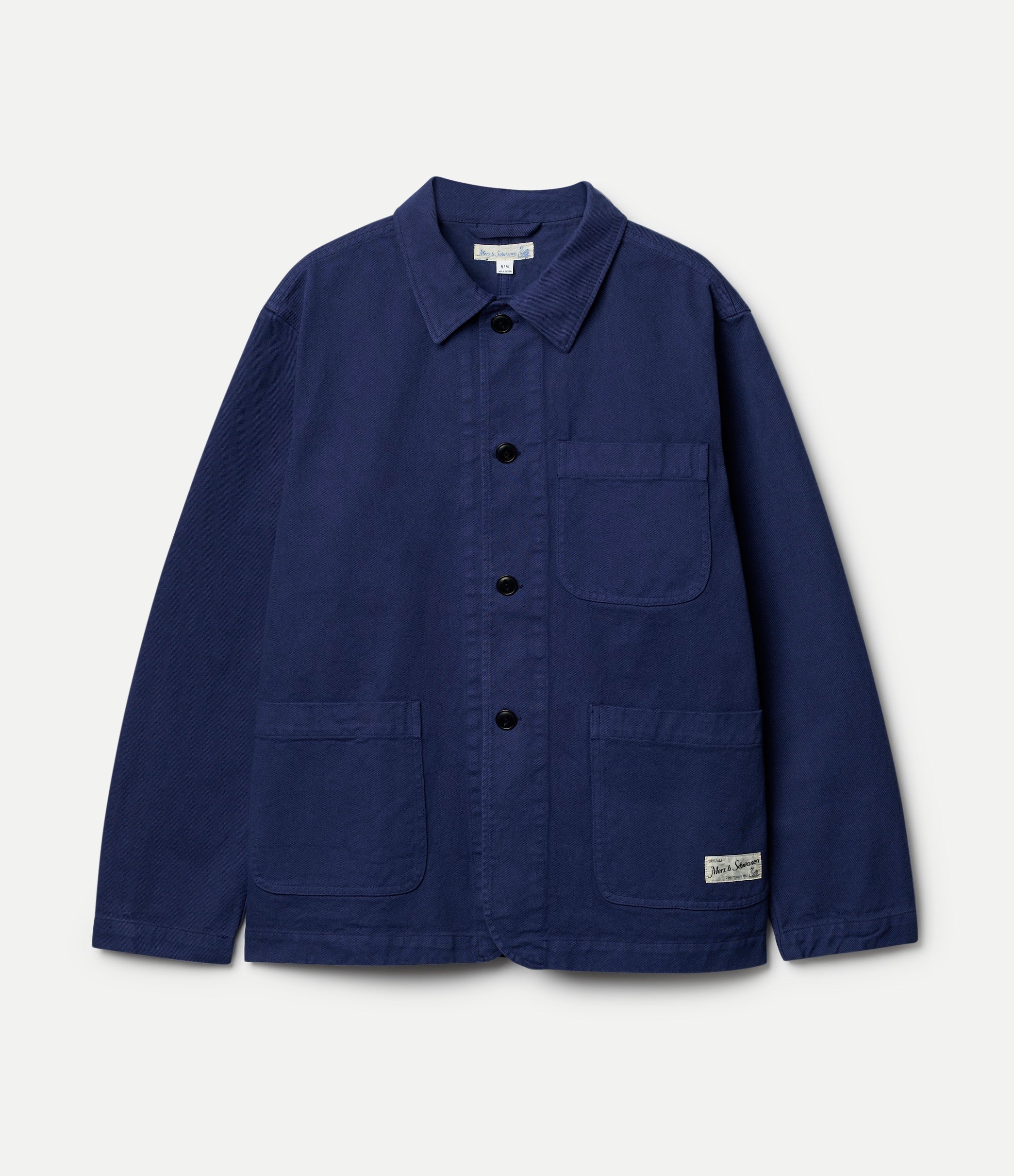 Navy blue twill jacket with button details on a light gray background
