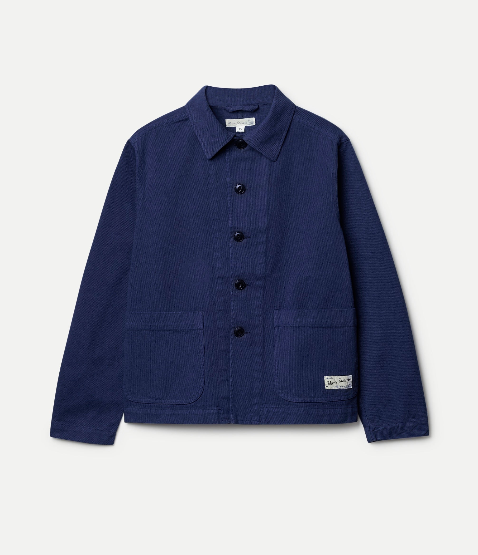 Navy blue cropped jacket with button details on a light gray background