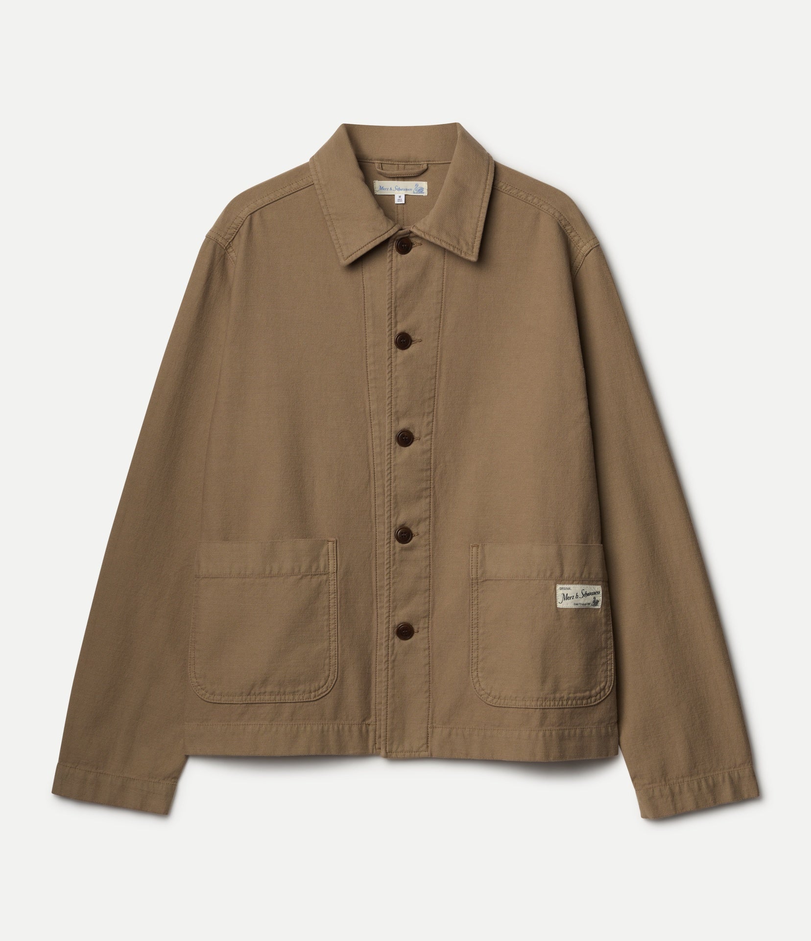 A brown utility jacket with a pointed collar, dark buttons, and two front patch pockets, shown flat against a light off-white background.