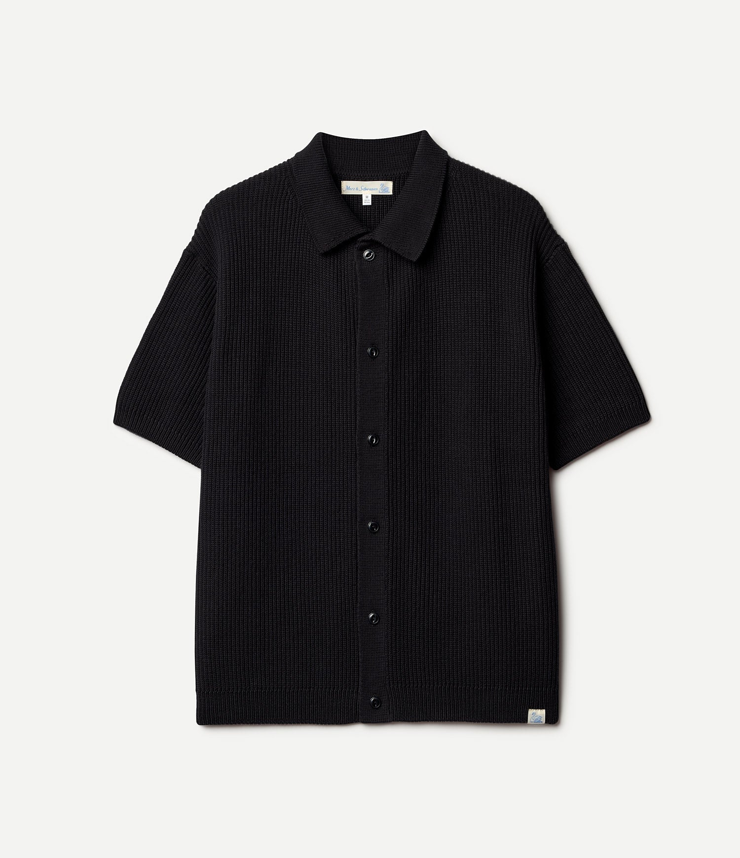 Black short-sleeve knitted shirt on a light gray background