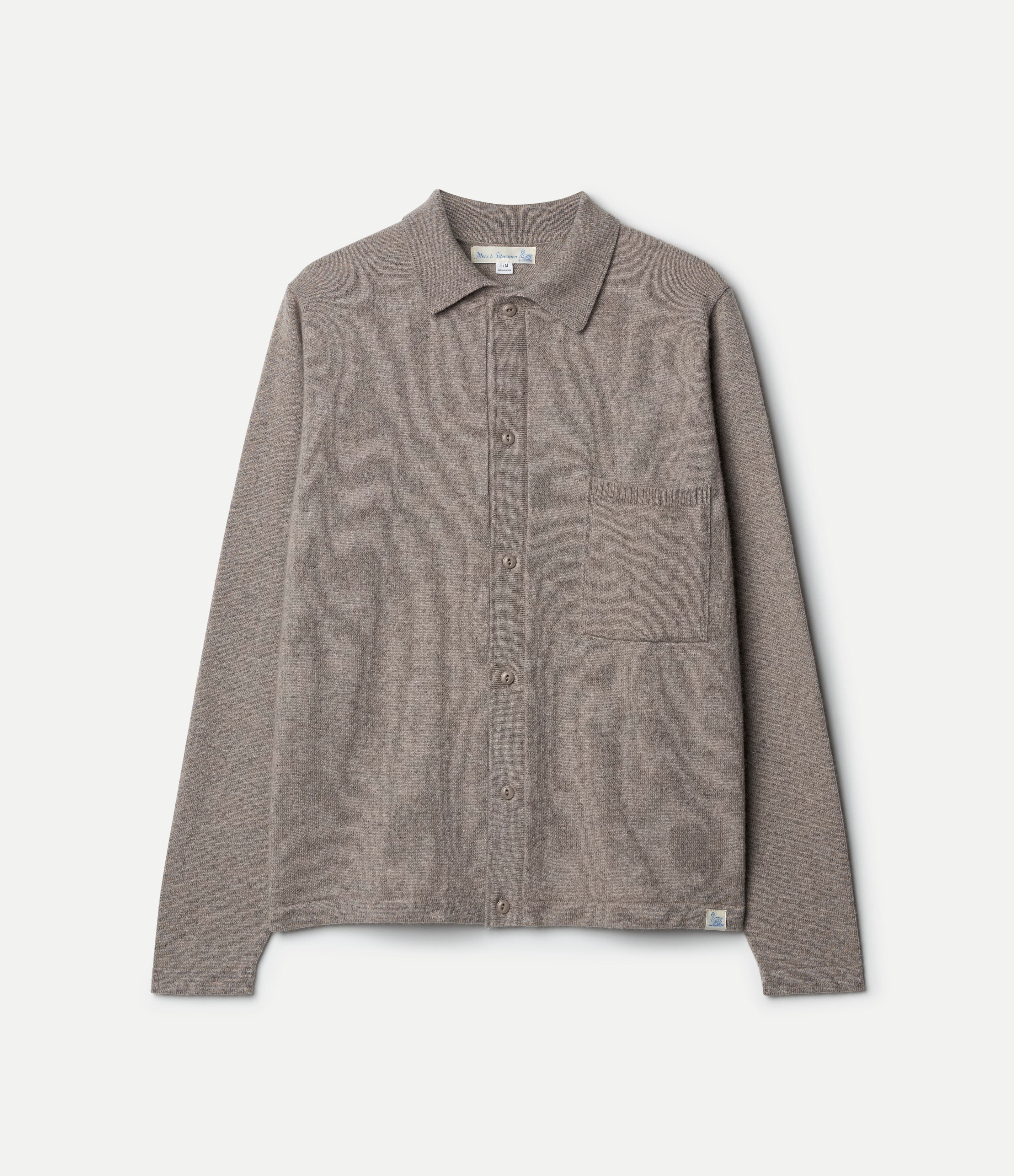Brown knitted shirt with a pocket on a white background