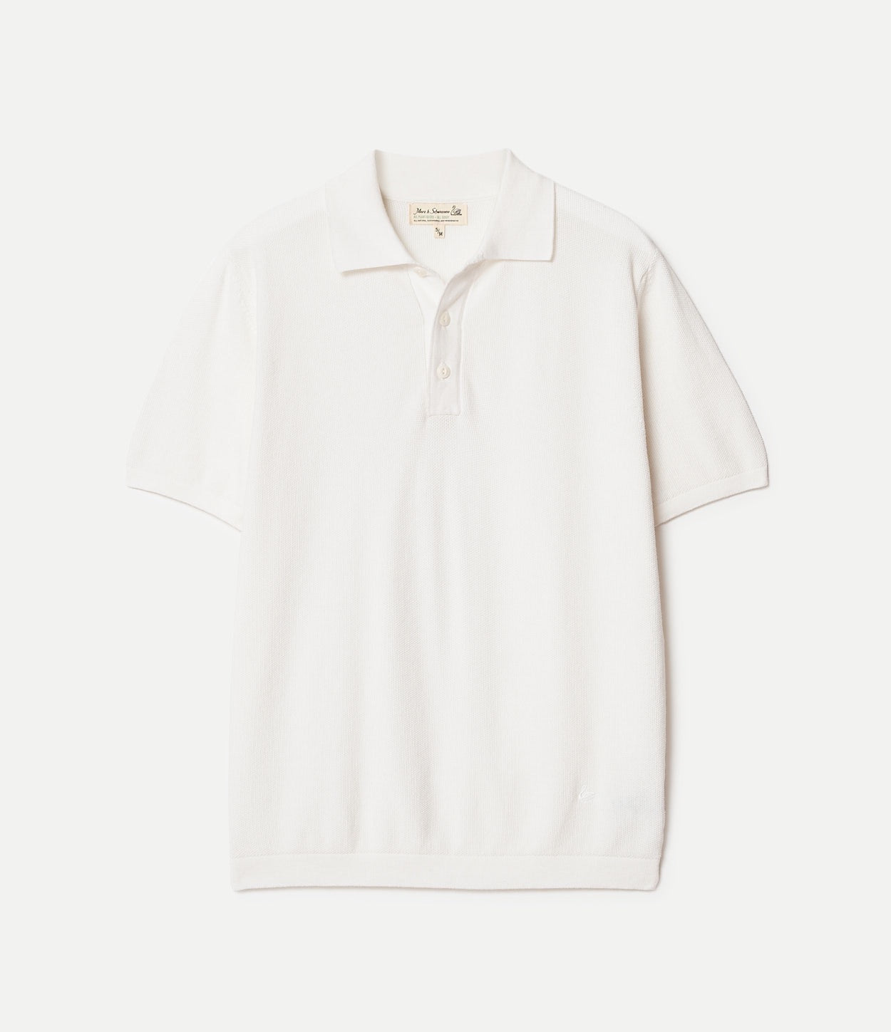 White knitted cotton polo shirt on a light beige background