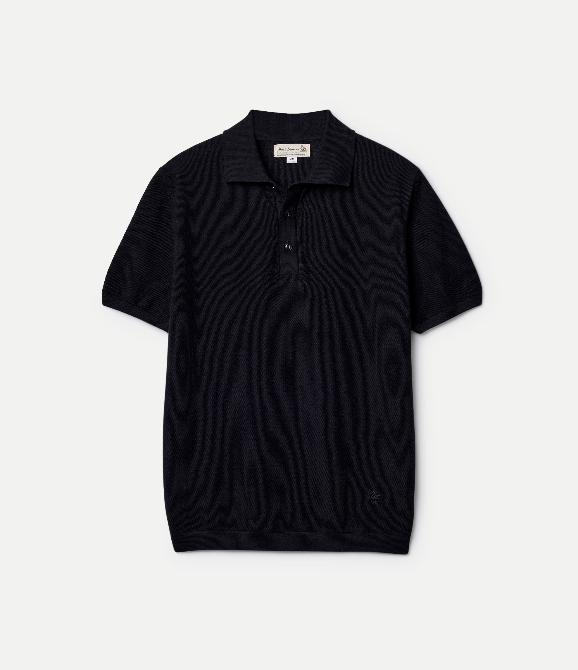 Black knitted cotton polo shirt on a light gray background