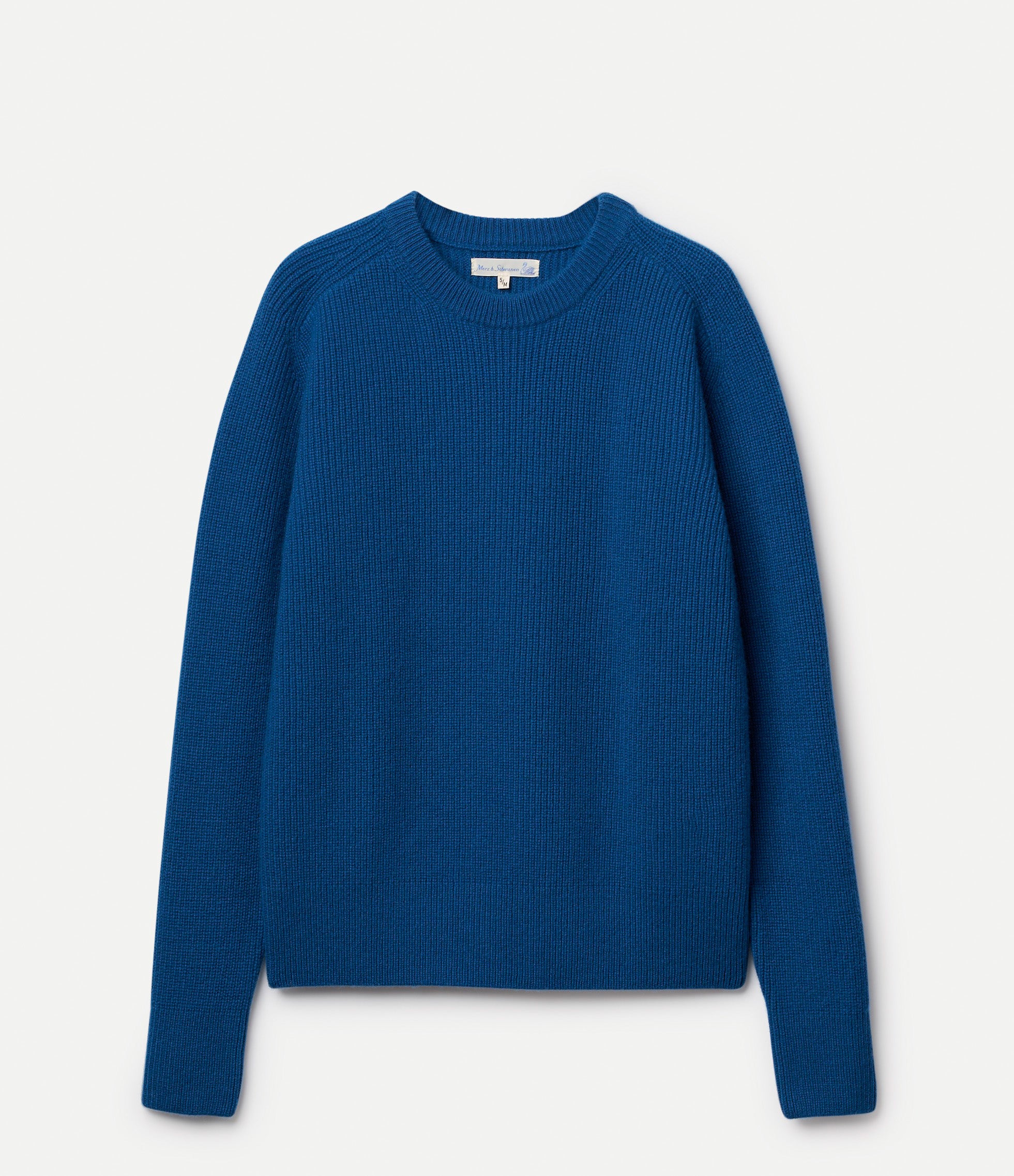 Blue ribbed sweater on a light gray background
