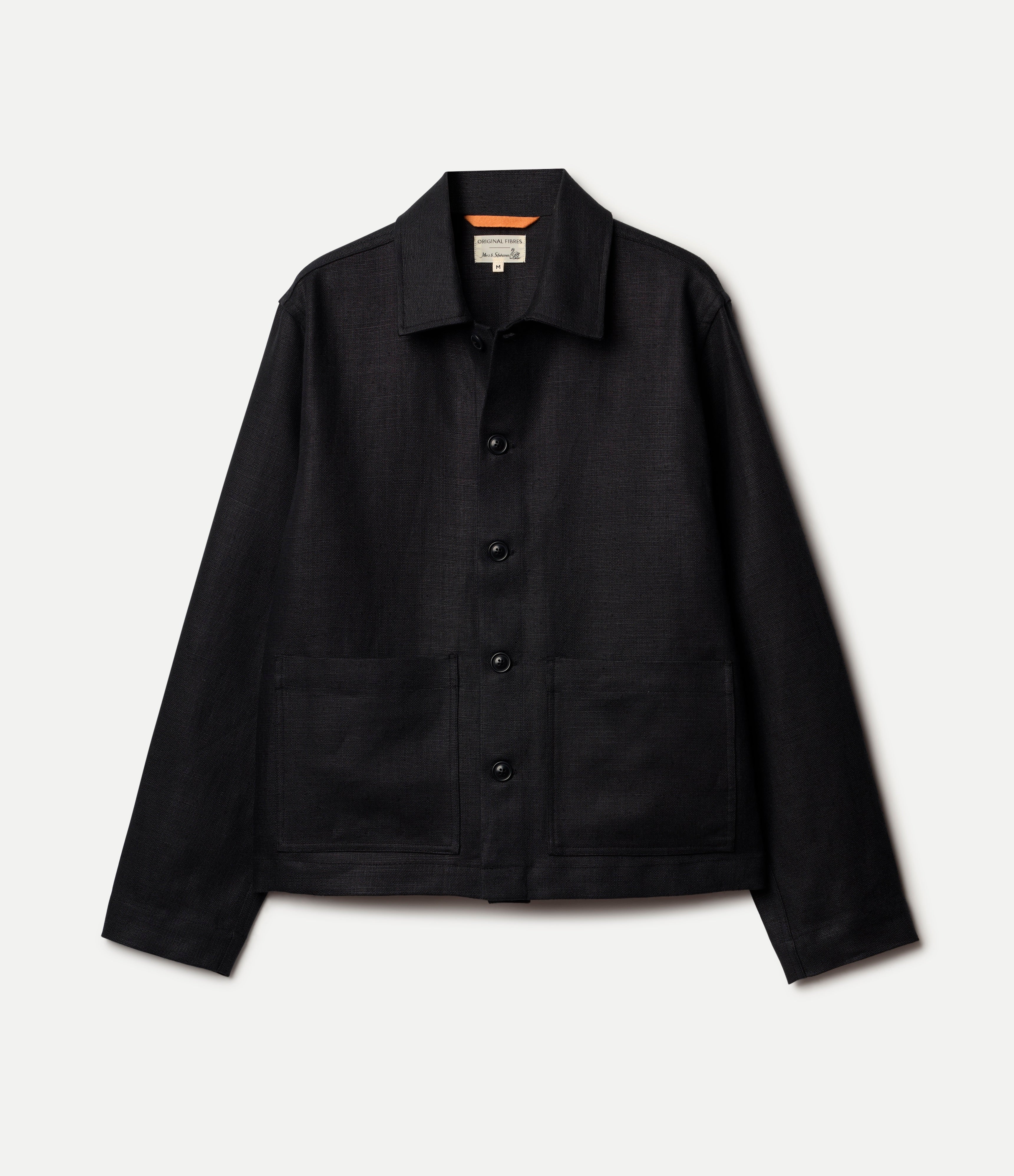 Black linen jacket on a light gray background