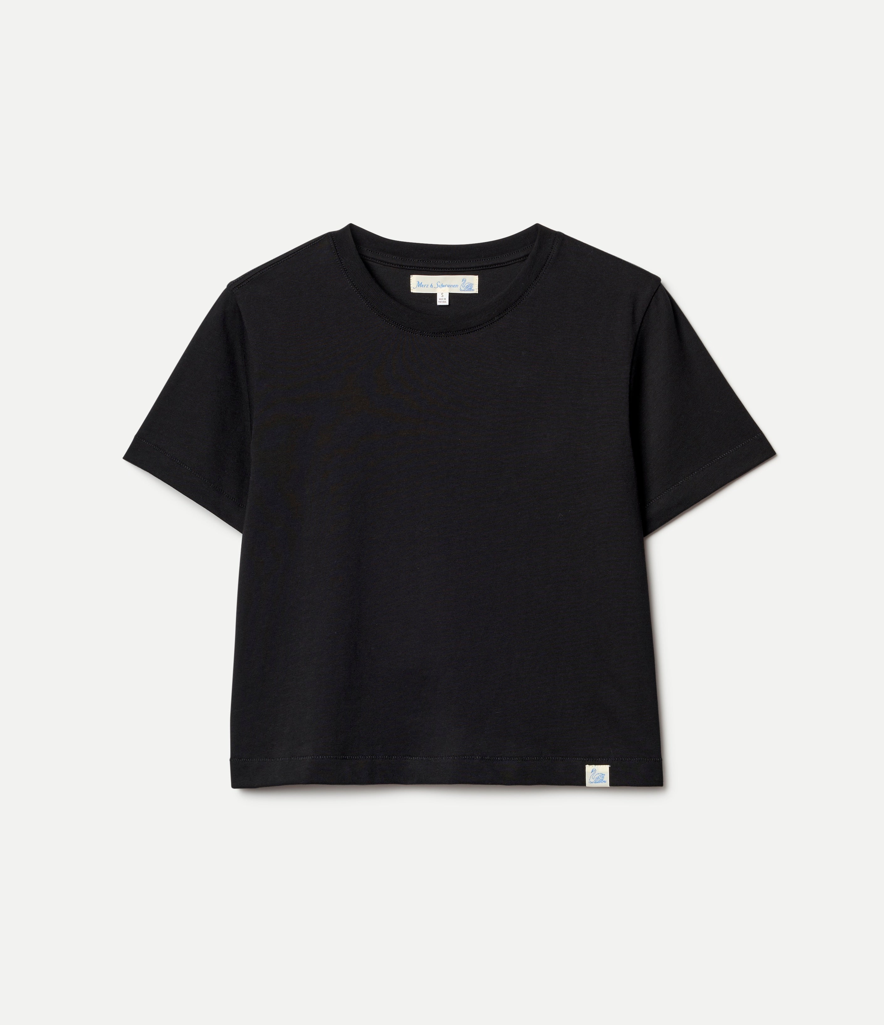 Black cropped t-shirt on a light gray background