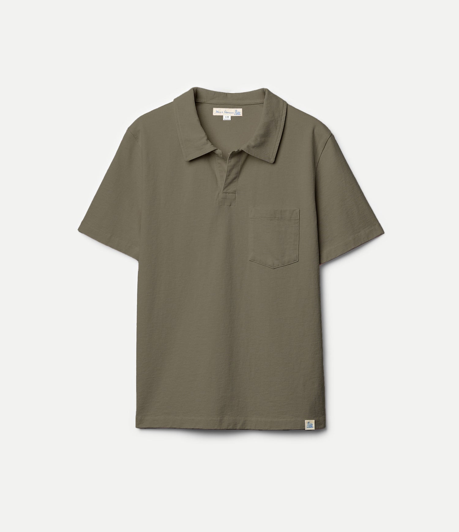 Green polo shirt on a hanger against a white background