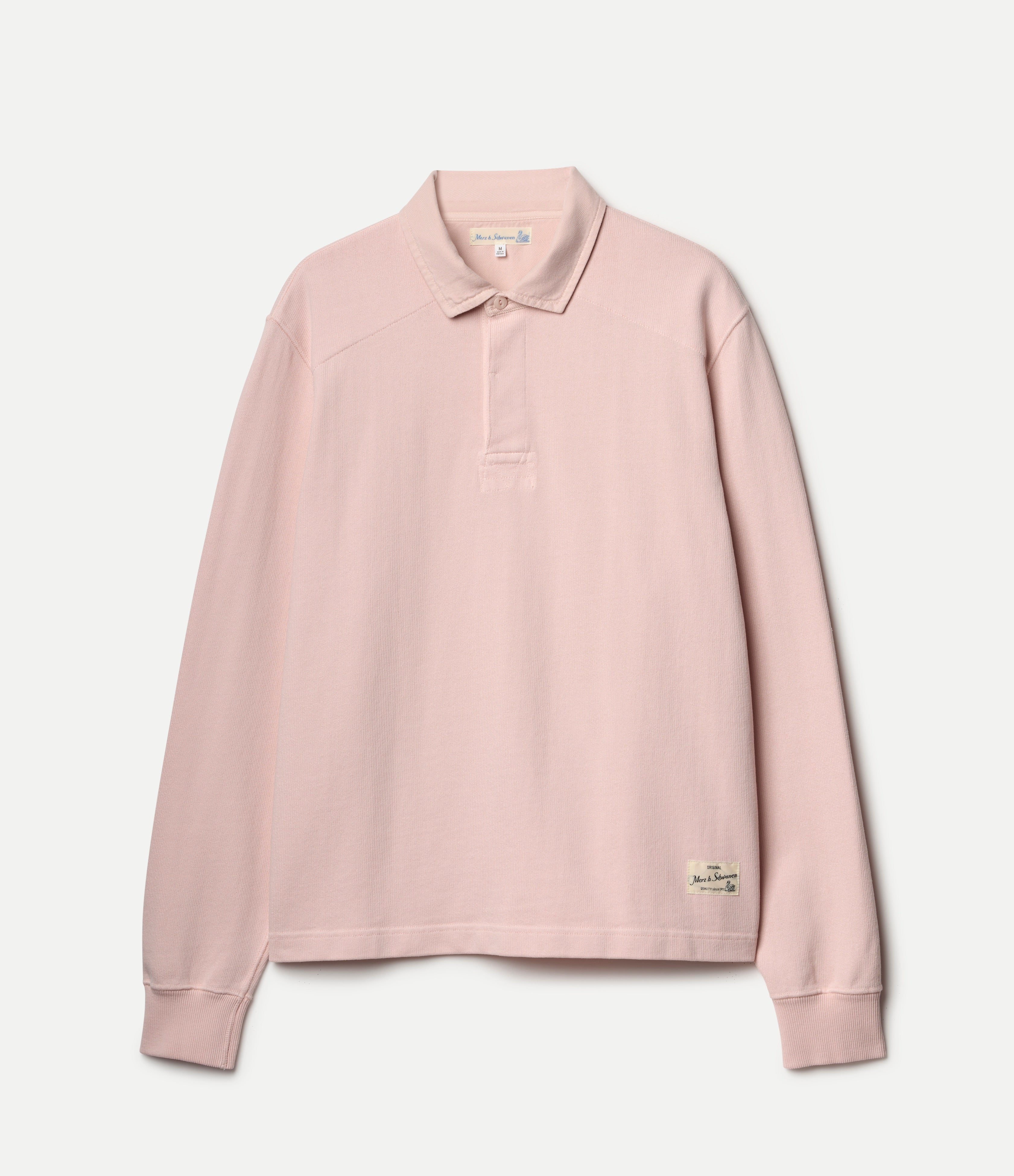 Pink long-sleeve rugby shirt on a light gray background