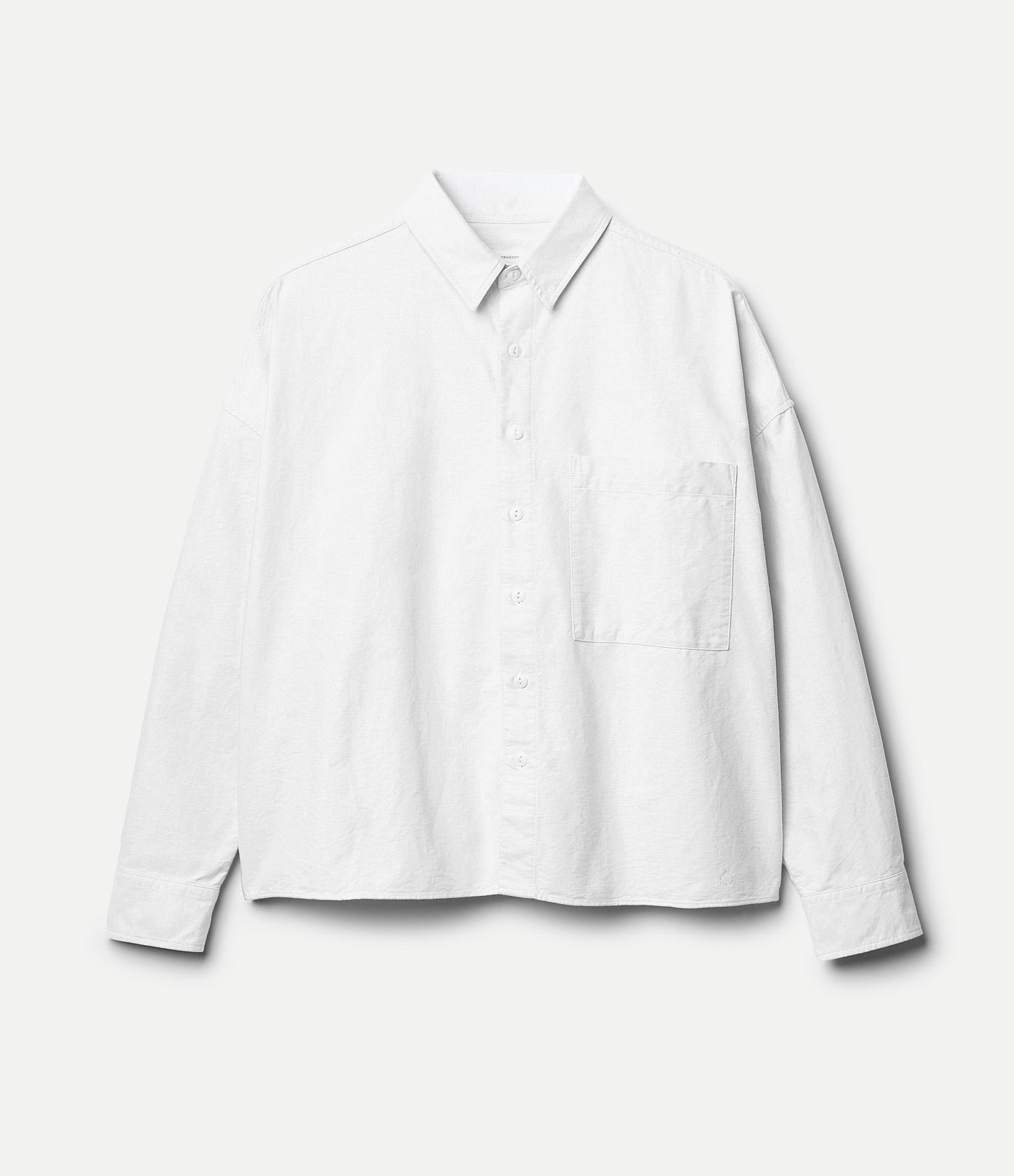White cropped oxford shirt on a light gray background