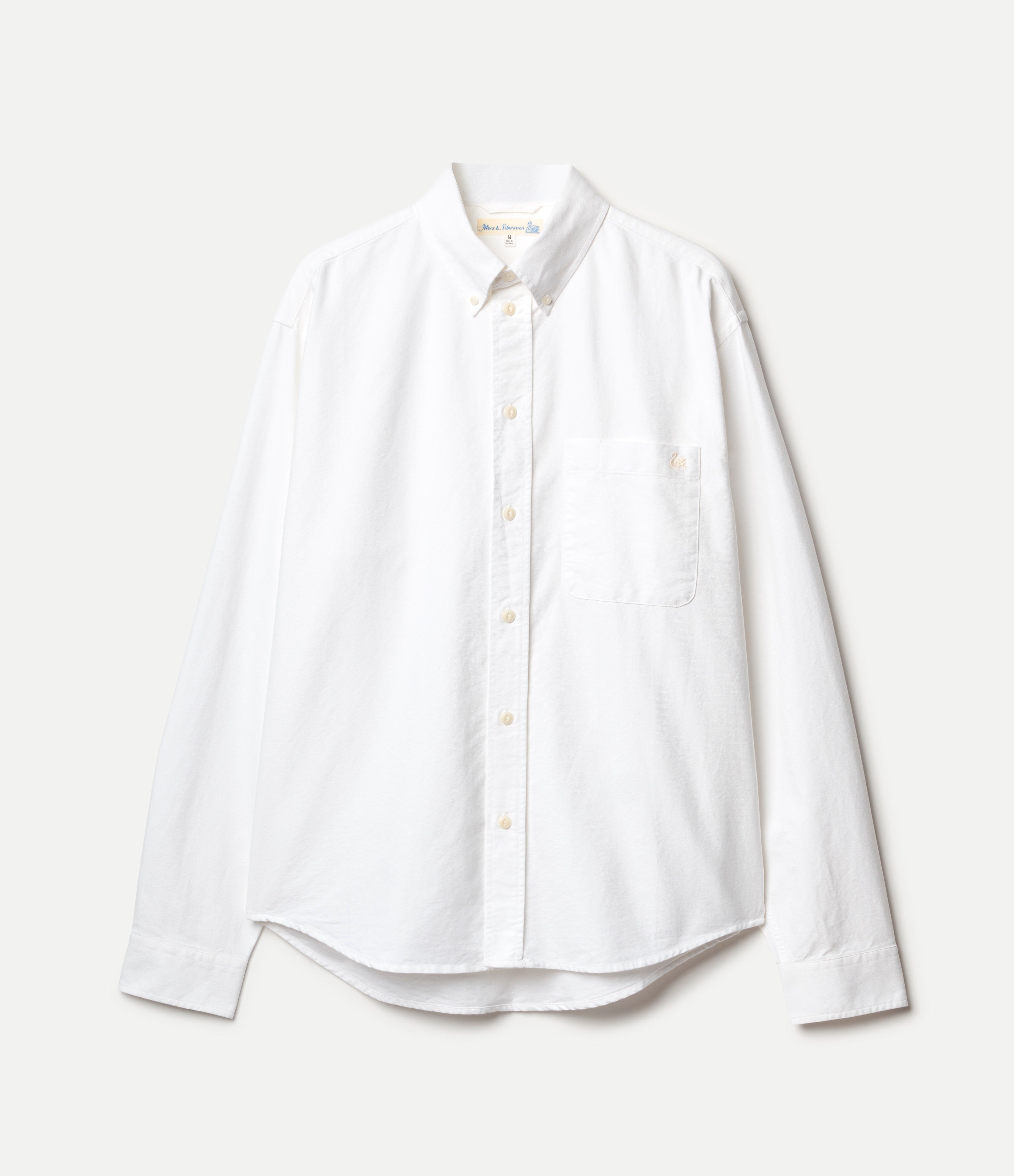 White button-down oxford shirt on a light gray background