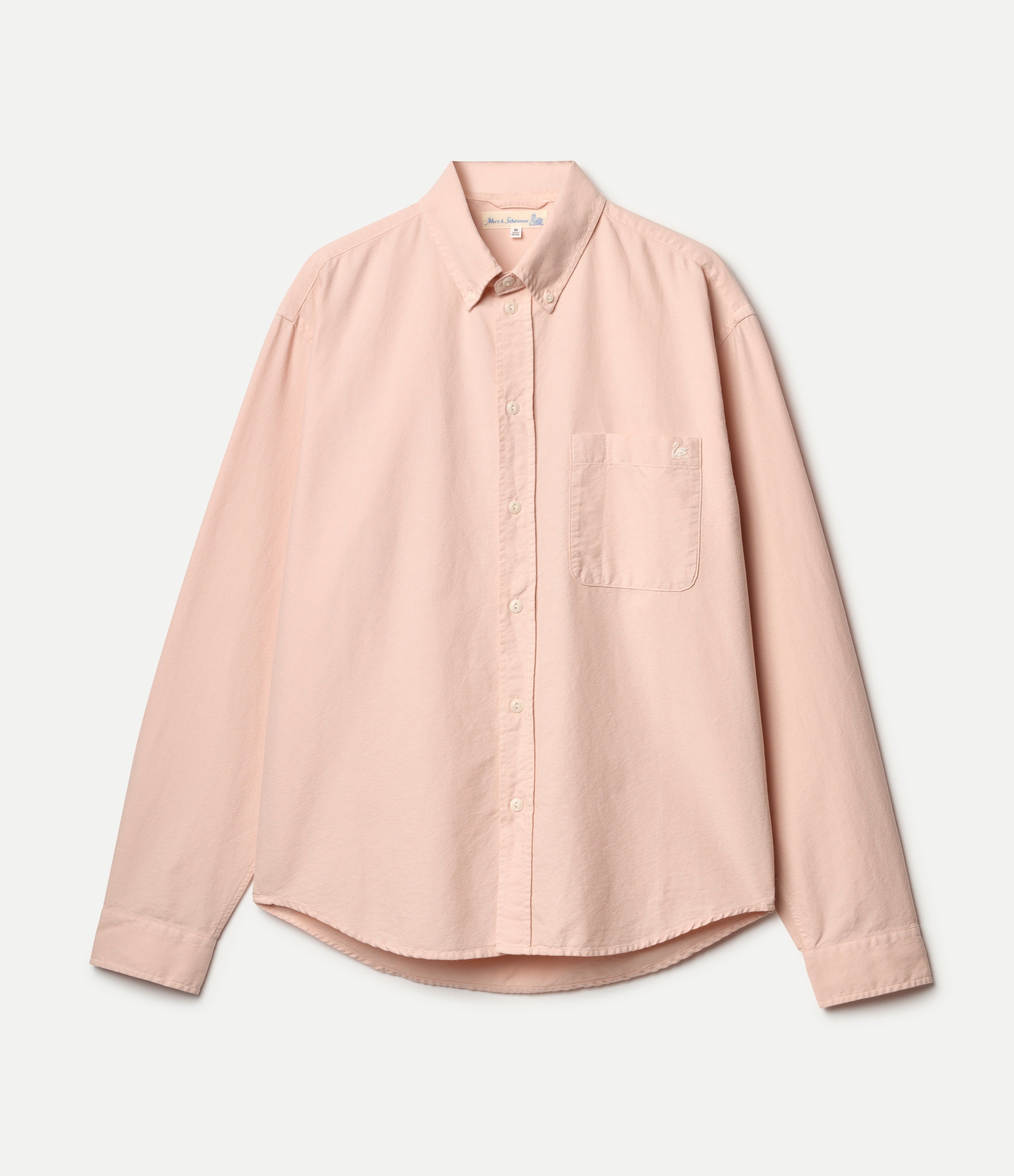 Pink button-down oxford shirt on a light gray background