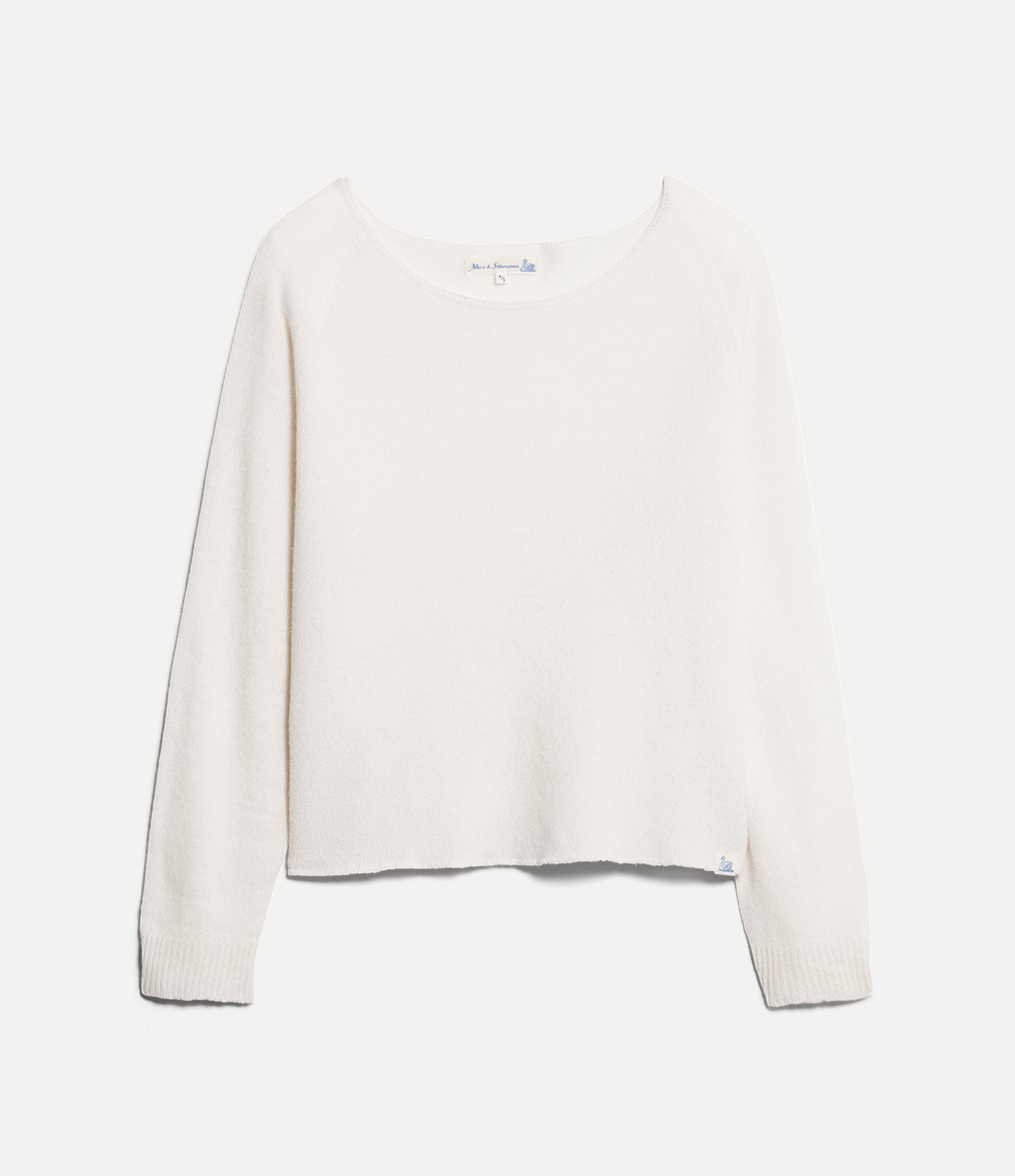 White lightweight sweater on a light gray background