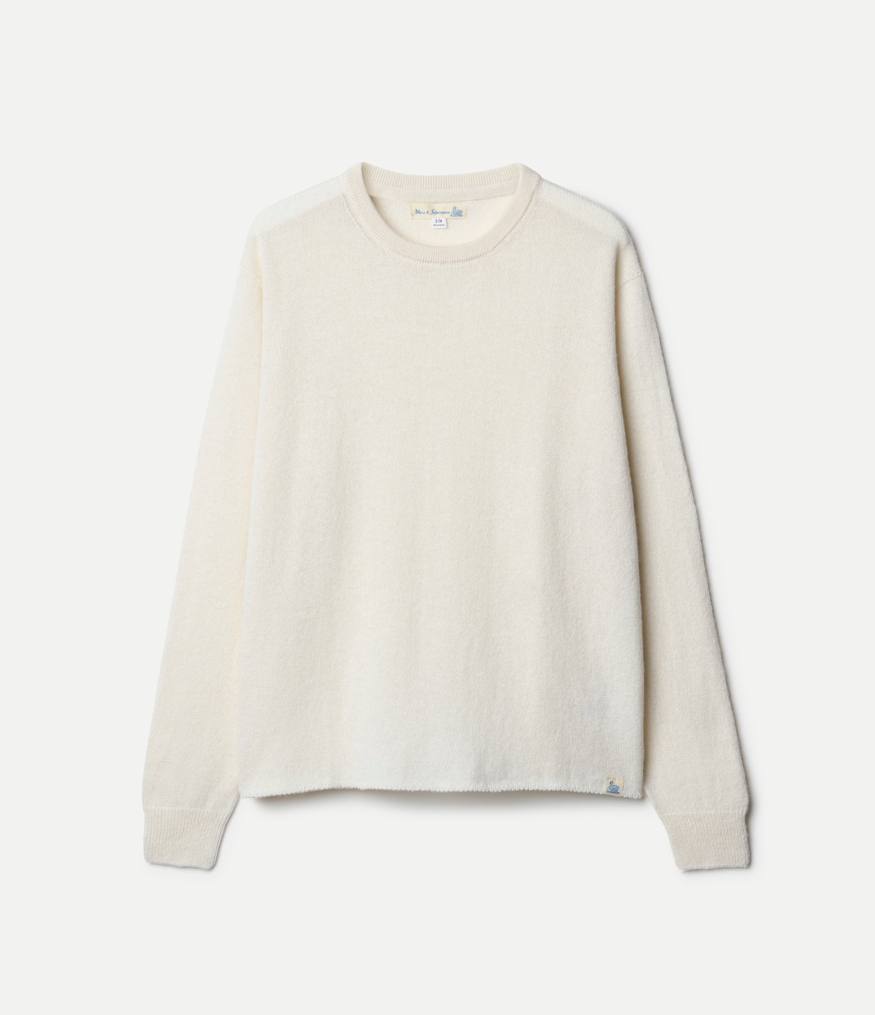 A beige, long-sleeved, extra-fine merino wool-cashmere-silk sweater against a white background.