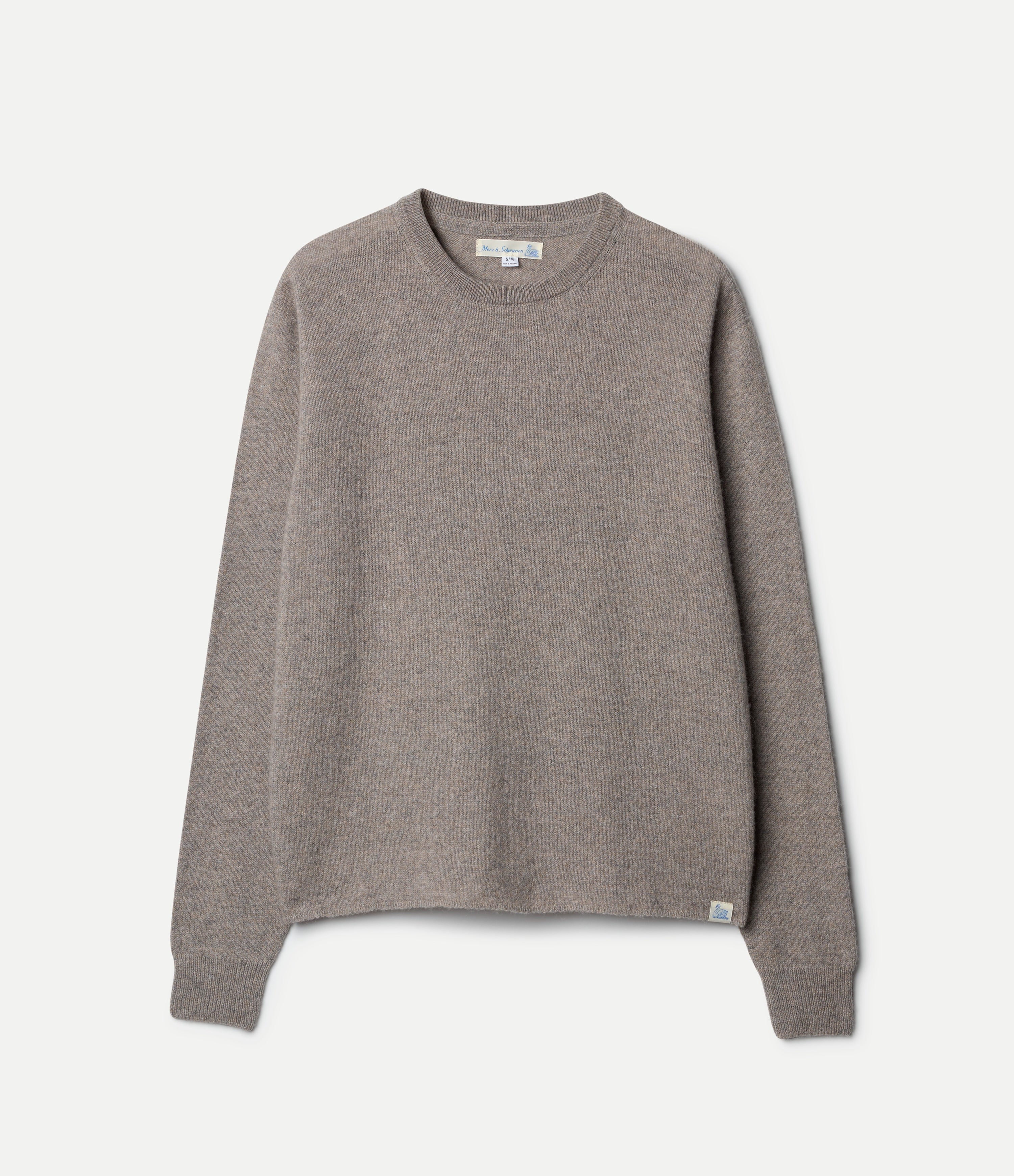A grey, long-sleeved, extra-fine merino wool-cashmere-silk sweater against a white background.
