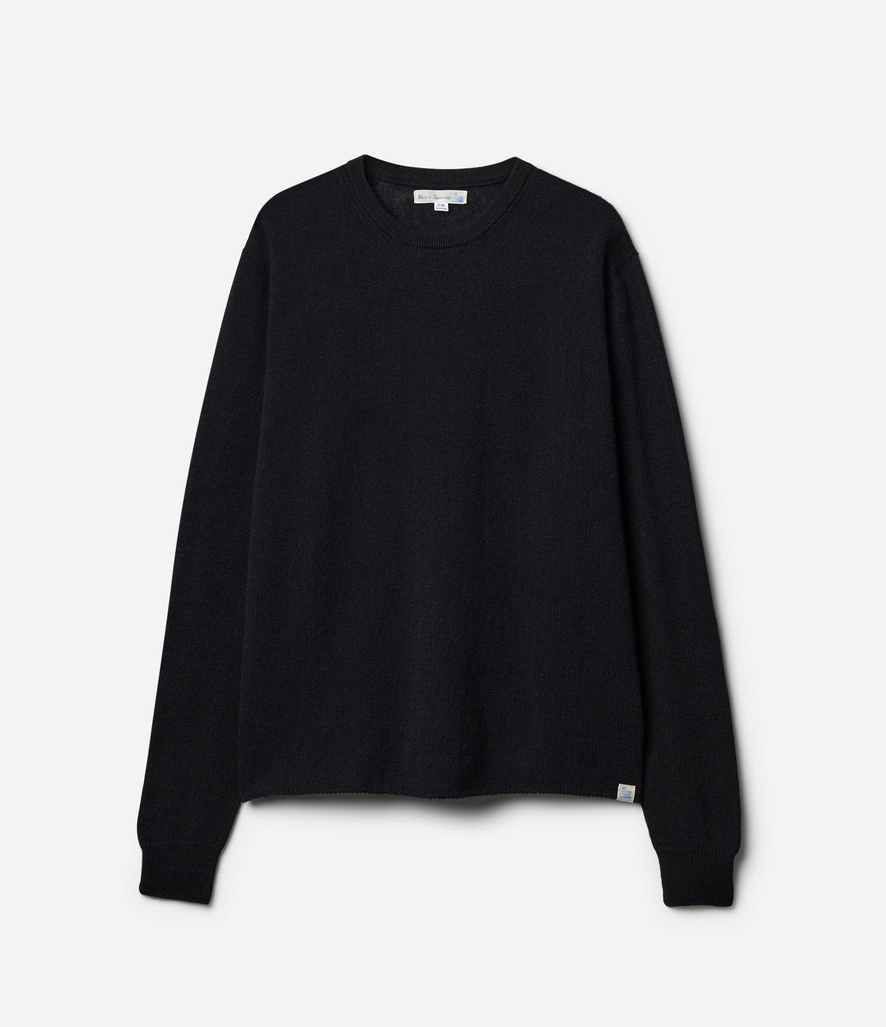 A black, long-sleeved, extra-fine merino wool-cashmere-silk sweater against a white background.