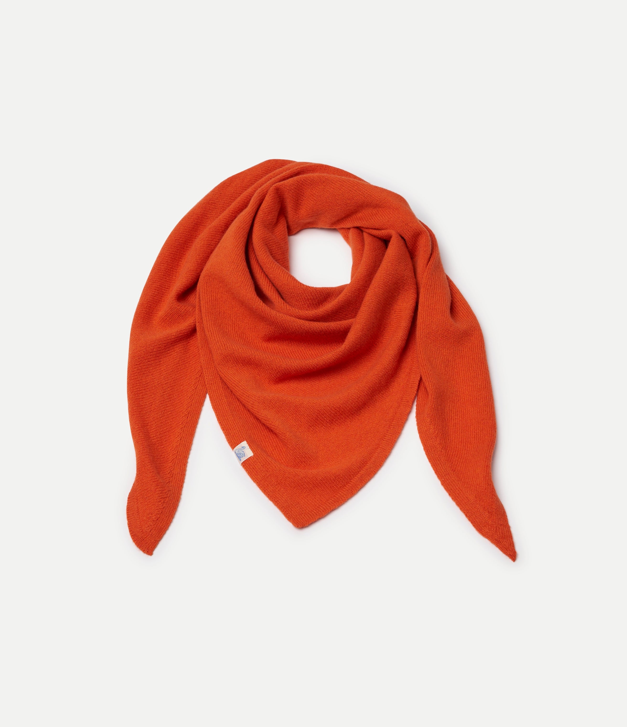 Orange Scarf made of merino wool, silk and cashmere against neutral background