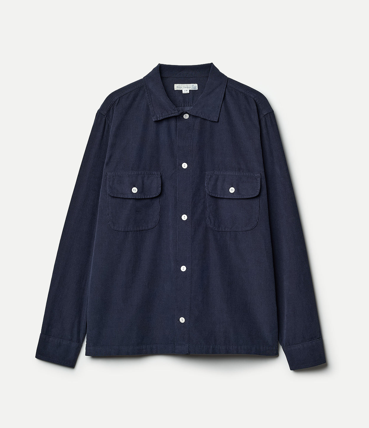 A long sleeve navy blue corduroy shirt with a collar, buttons, and two front pockets, displayed on a hanger against a white background.