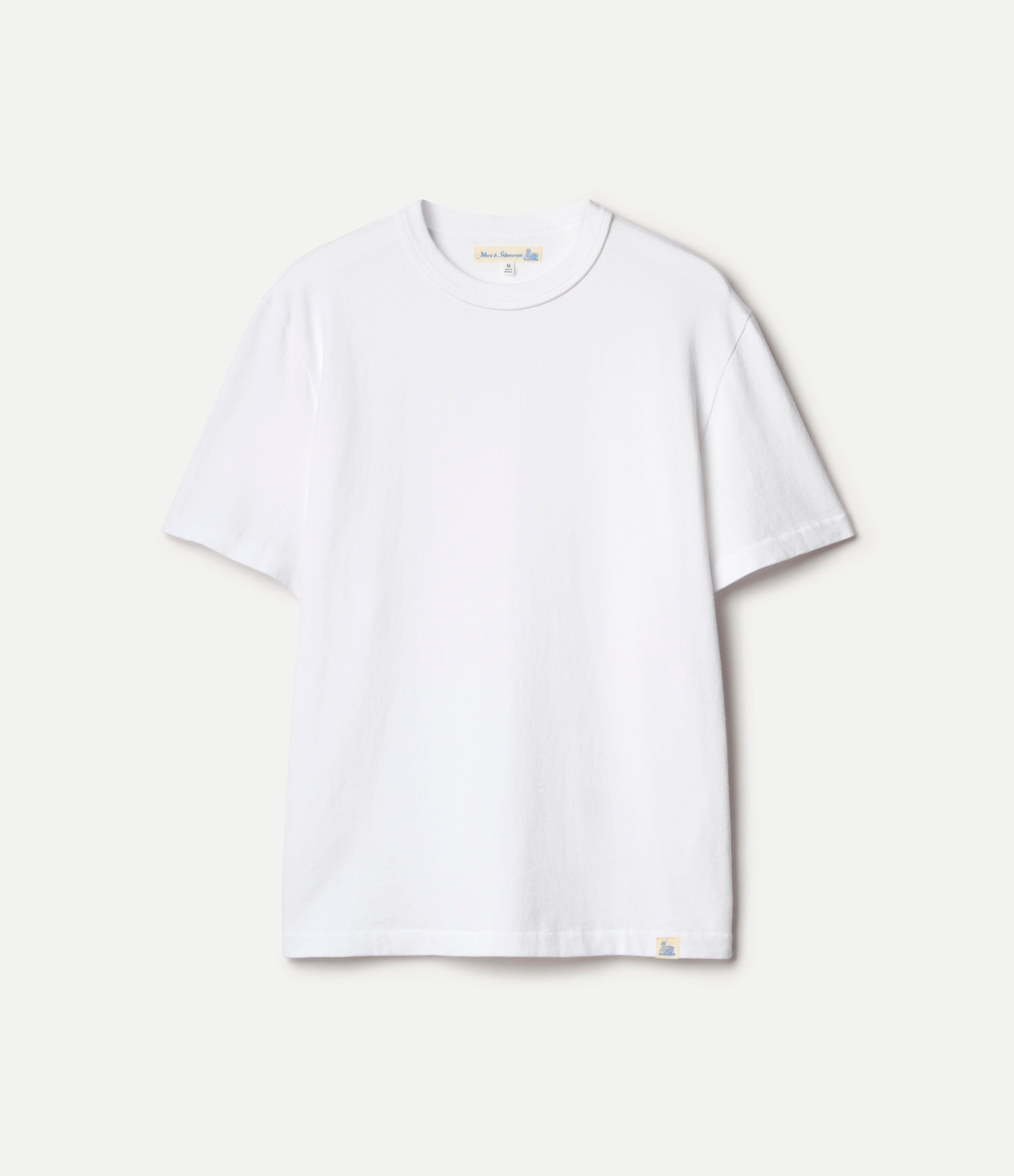 White organic cotton t-shirt on a light beige background