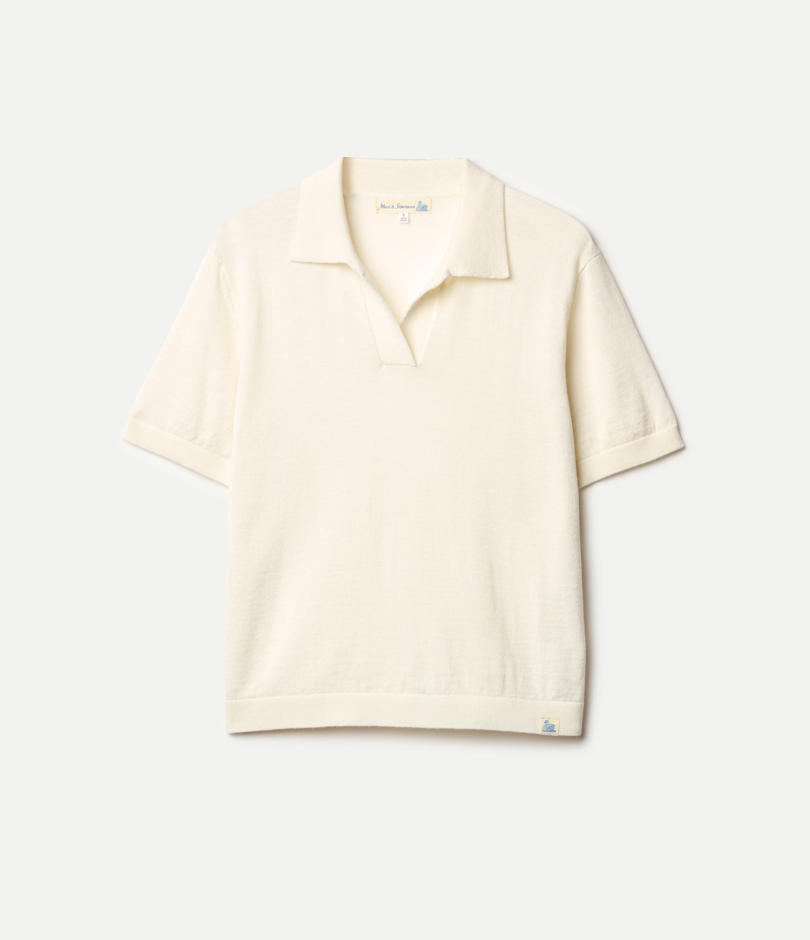 Beige  knitted merino wool polo shirt on a light gray background