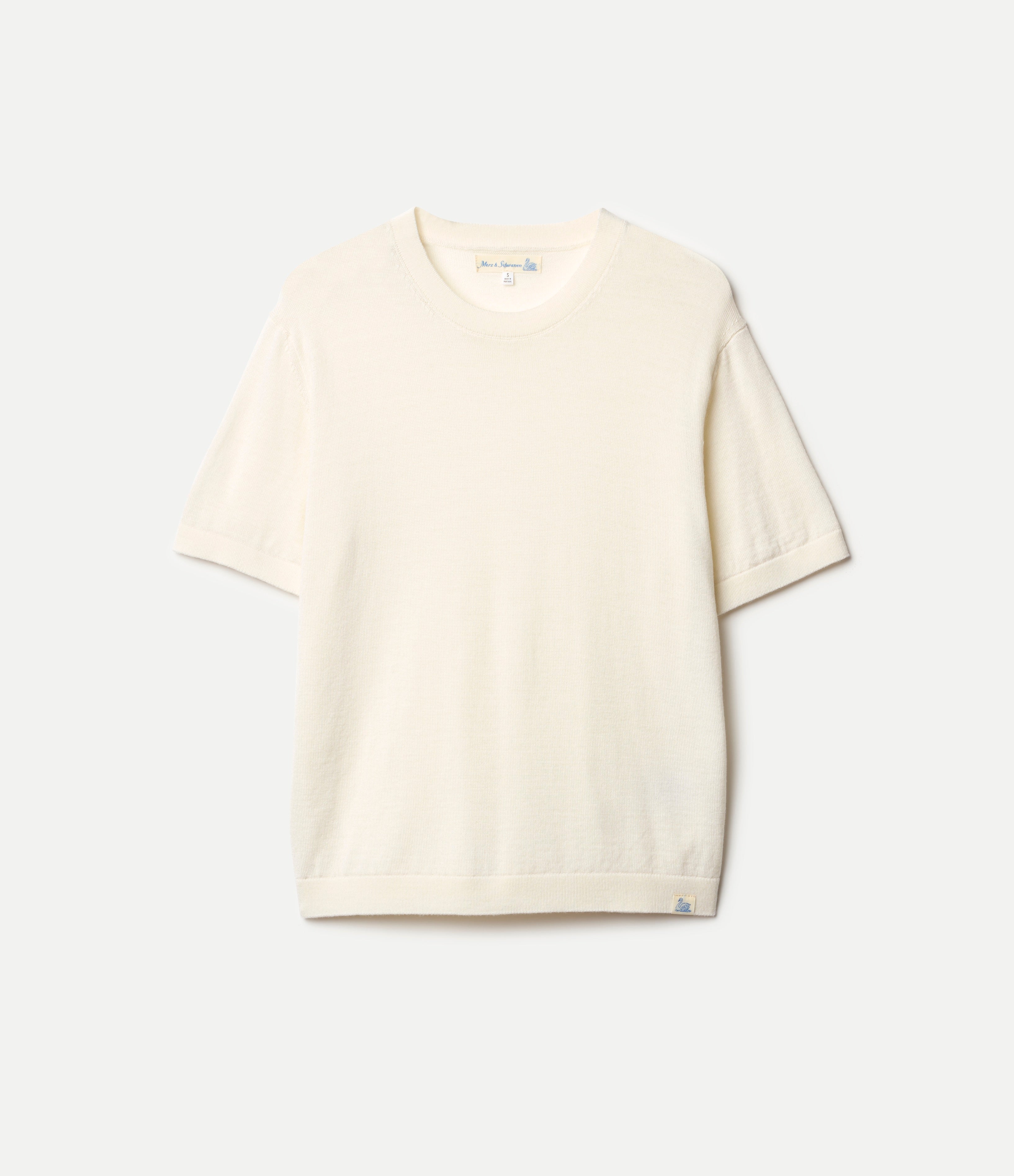 Beige knitted merino wool  t-shirt on a light gray background
