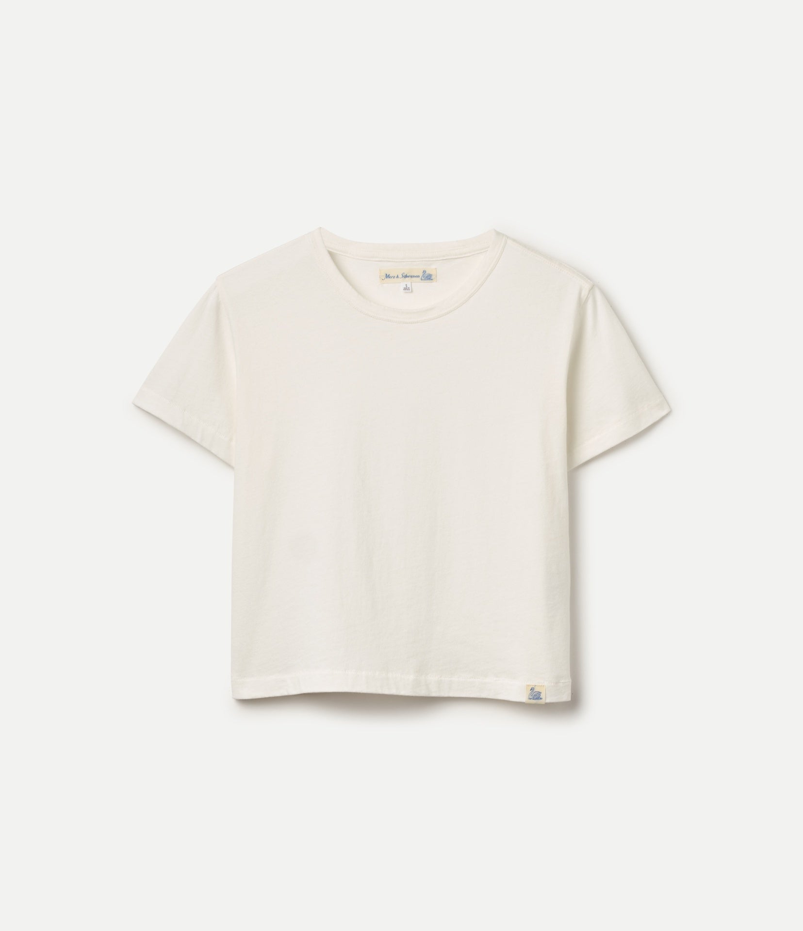 A white cropped short-sleeve t-shirt with a crew neck, laid flat against a light gray background.
