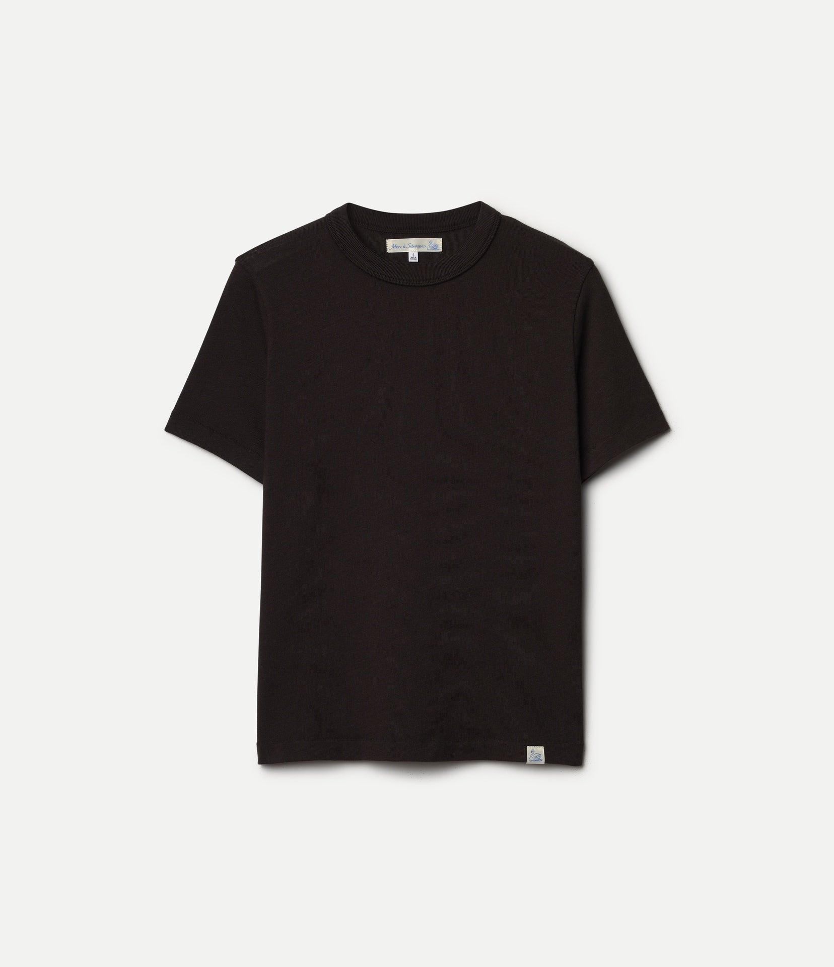 A dark brown short-sleeve crewneck t-shirt with a small white tag near the bottom hem, displayed flat against a light gray background.